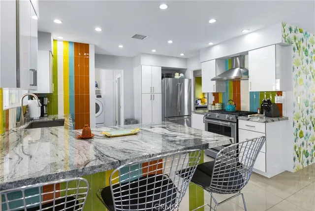 a kitchen with sink and cabinets