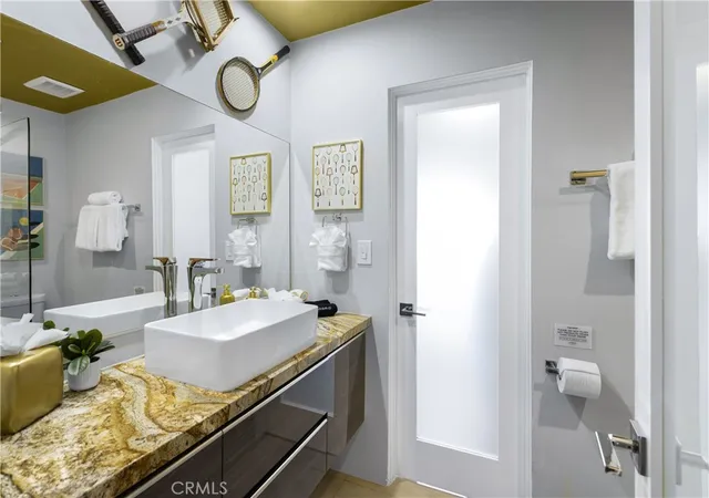 a spacious bedroom with a bed and a window