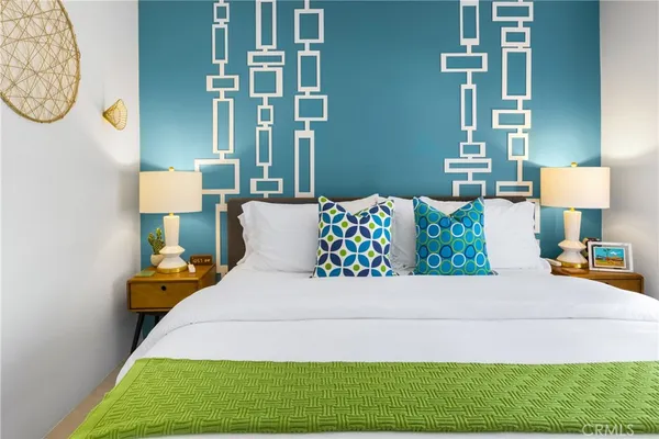 a bedroom with a bed and a table in it