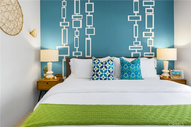 a bedroom with a bed and a table in it