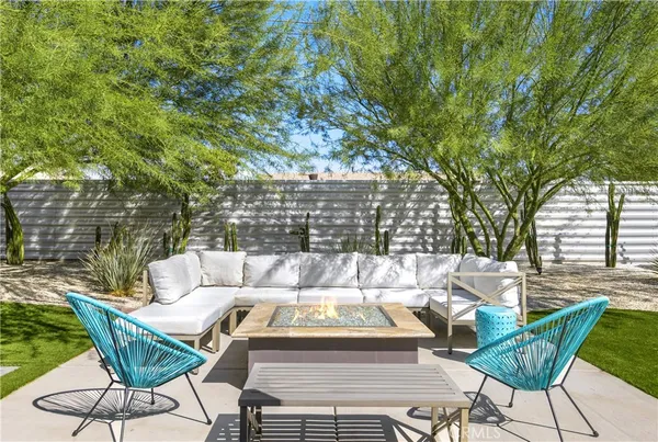a view of backyard with outdoor seating