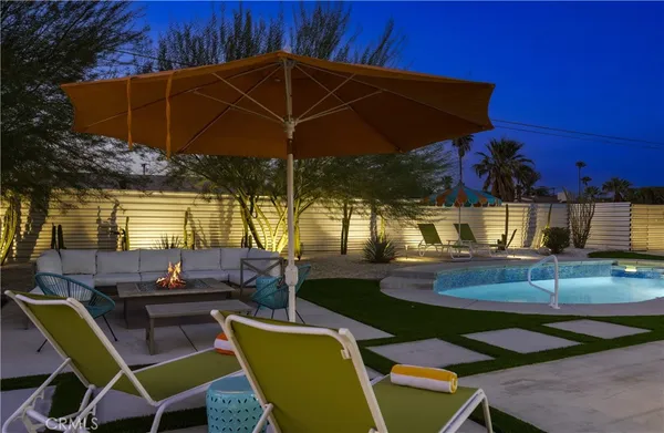 a view of a swimming pool with an outdoor space