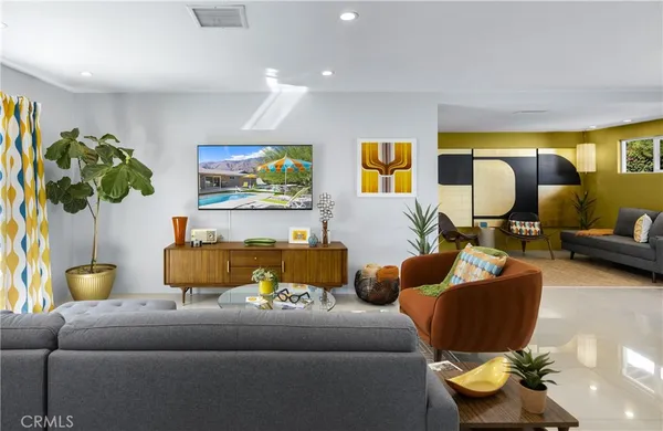 a living room with furniture and a large window