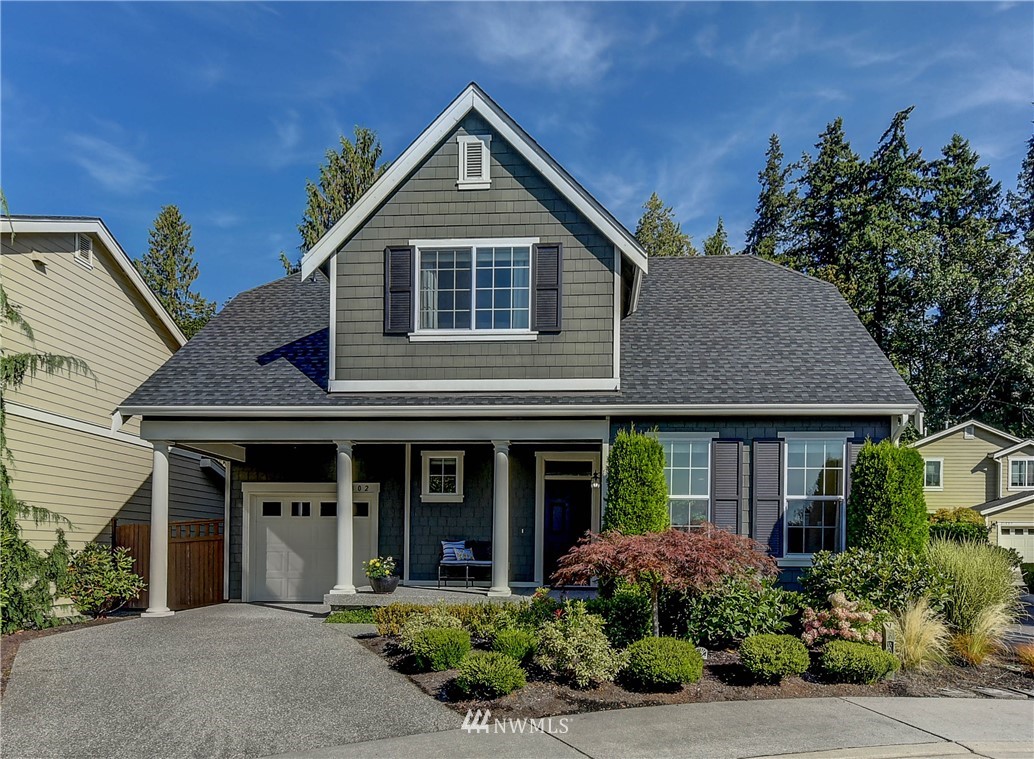 21802 38th Drive Southeast Bothell, WA 98021 - Photo 1 of 26 a front view of a house with a garden