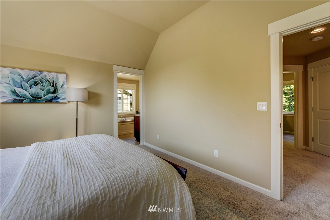 21802 38th Drive Southeast Bothell, WA 98021 - Photo 13 of 26 a bedroom with a bed and window