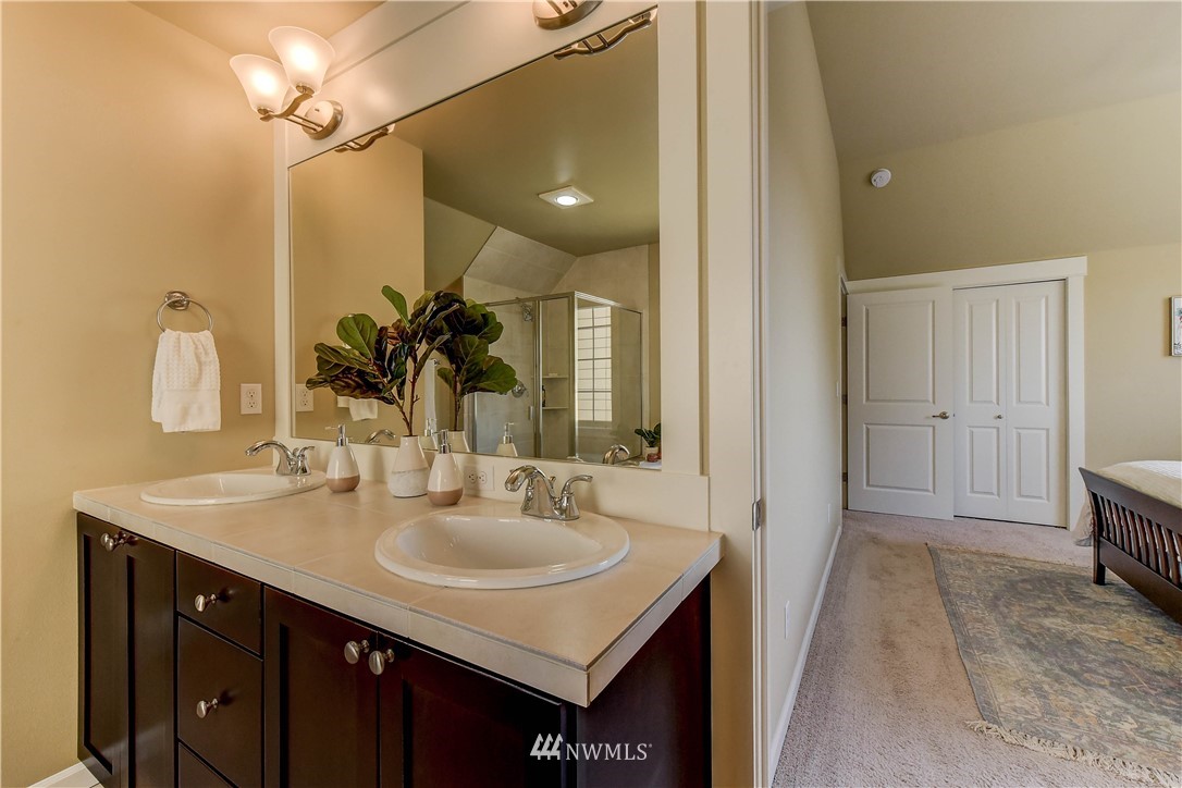 21802 38th Drive Southeast Bothell, WA 98021 - Photo 15 of 26 a bathroom with a sink vanity and a mirror