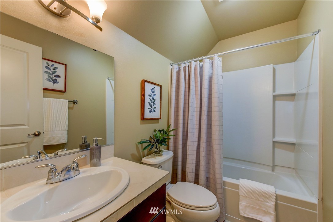 21802 38th Drive Southeast Bothell, WA 98021 - Photo 18 of 26 a bathroom with a sink and a mirror