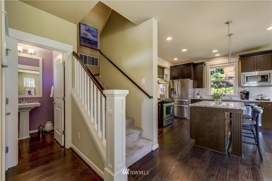 21802 38th Drive Southeast Bothell, WA 98021 - Photo 3 of 26 a living room with stainless steel appliances furniture and a wooden floor
