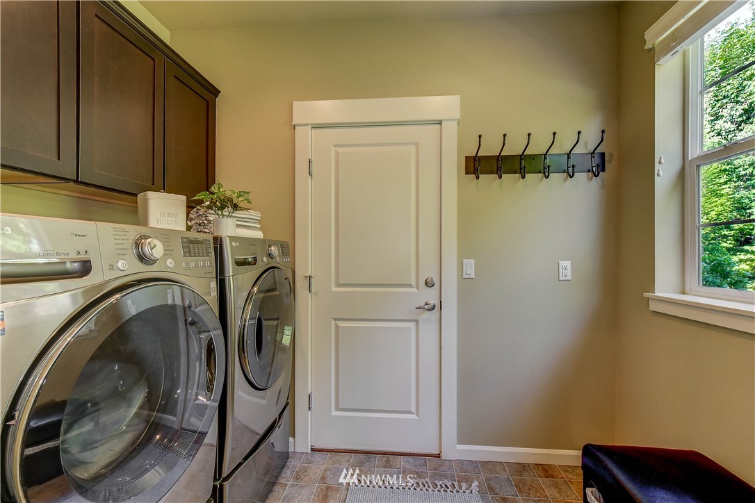 21802 38th Drive Southeast Bothell, WA 98021 - Photo 21 of 26 a utility room with sink dryer and washer