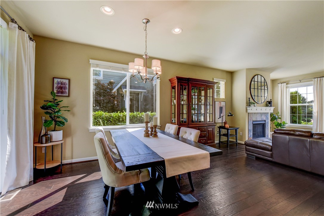21802 38th Drive Southeast Bothell, WA 98021 - Photo 7 of 26 a view of a dining room with furniture window and wooden floor