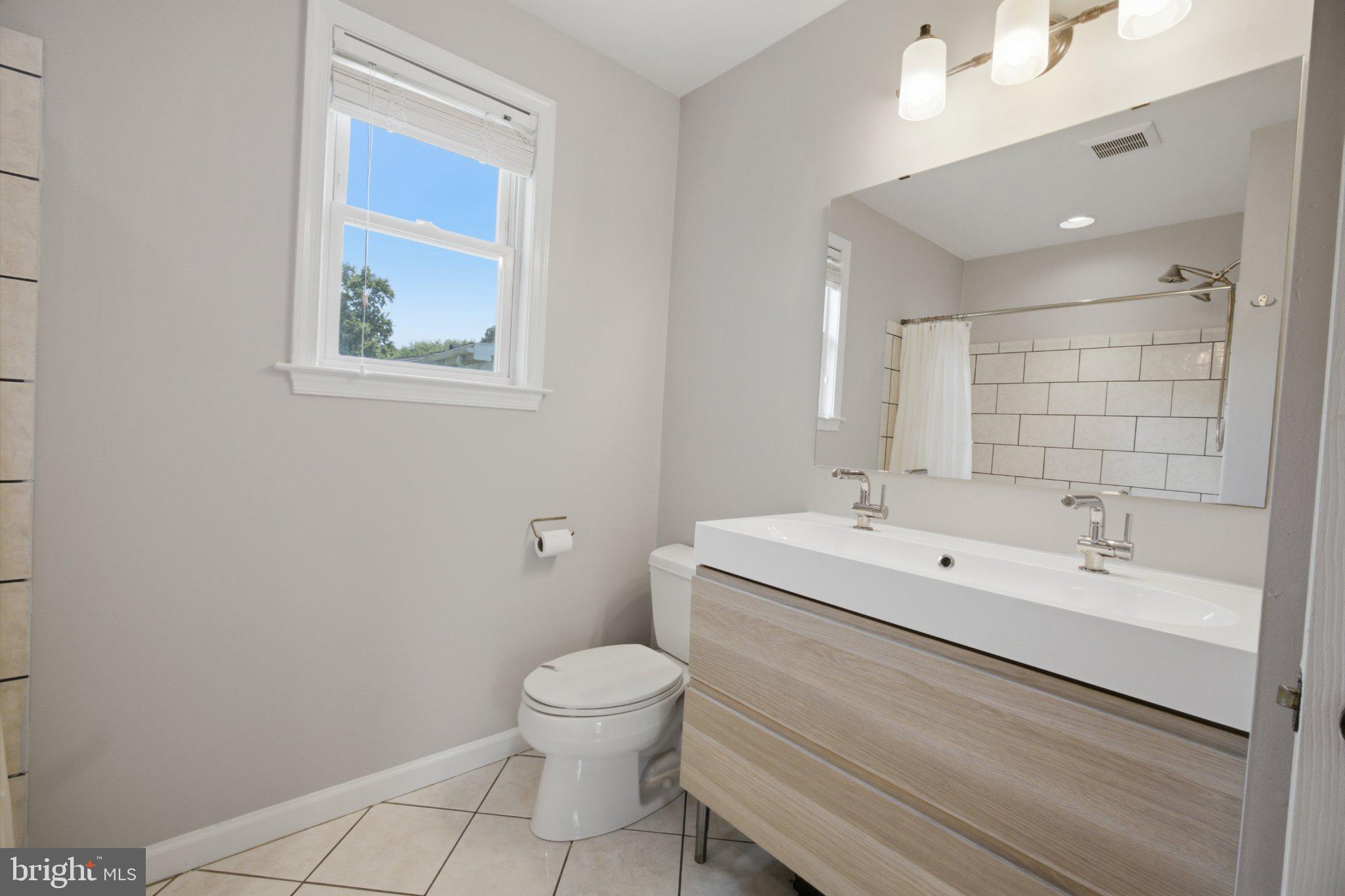 5650 Deale Churchton Road Churchton, MD 20733 - Photo 22 of 31 Modern bathroom with natural light.