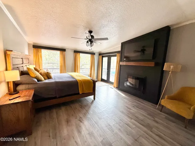 a bedroom with a bed and a fireplace