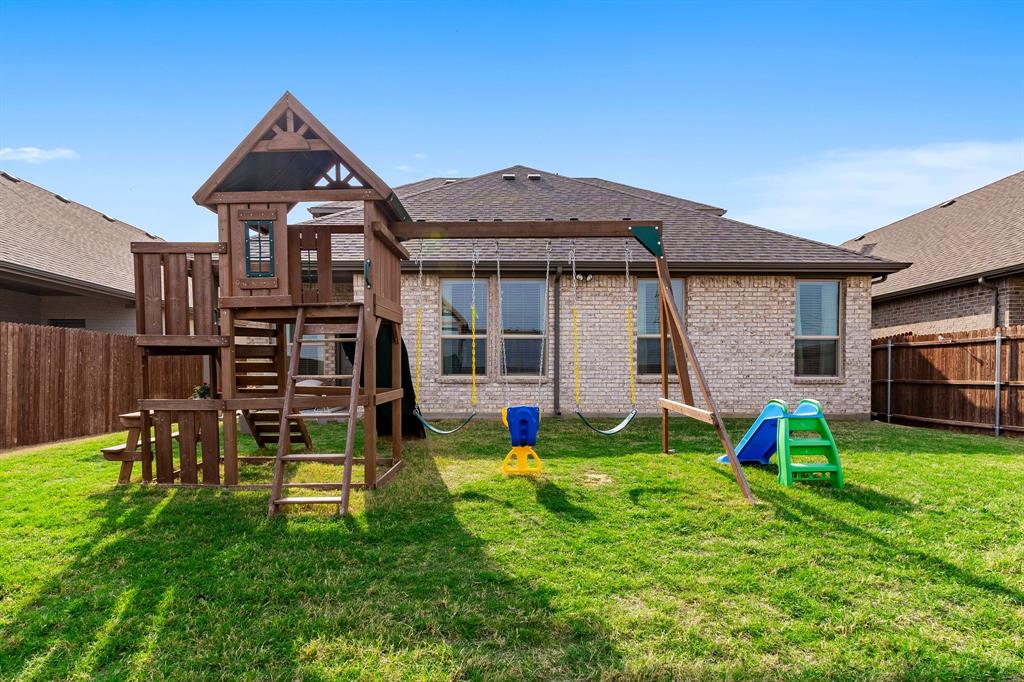 1125 Knightsbridge Road Argyle, TX 76226 - Photo 22 of 27 a view of an house with backyard and a patio