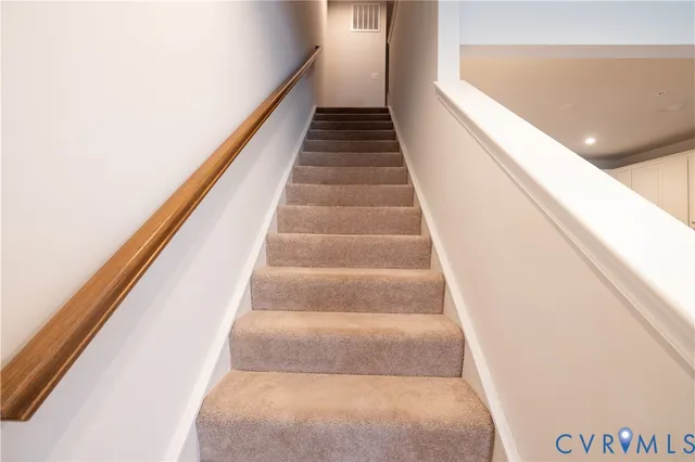 a view of bedroom with a bed and a hallway