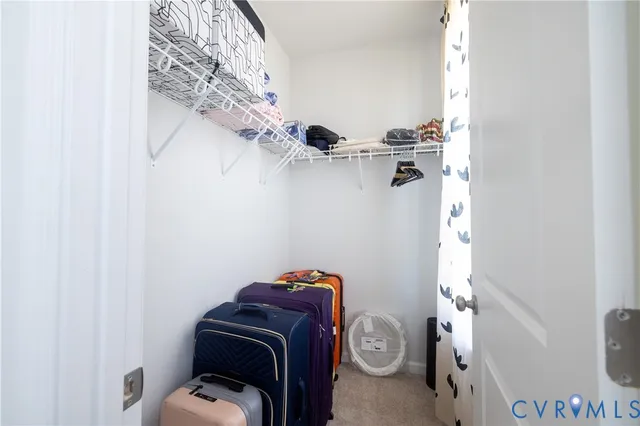 a bathroom with a double vanity sink and mirror with shower