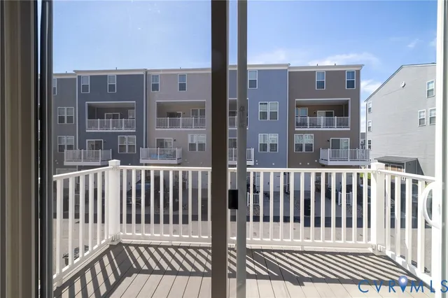 a view of a balcony with wooden floor