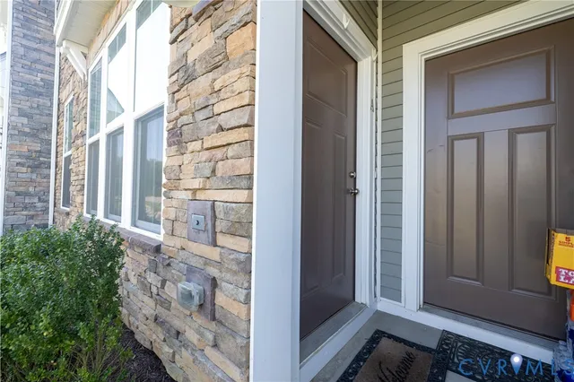 a view of a door and brick wall