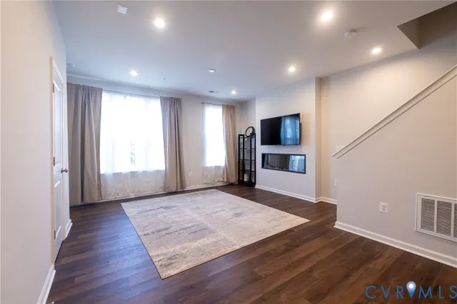 a view of a room with window and wooden floor