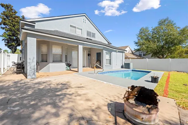 a spacious bathroom with a granite countertop sink mirror and shower