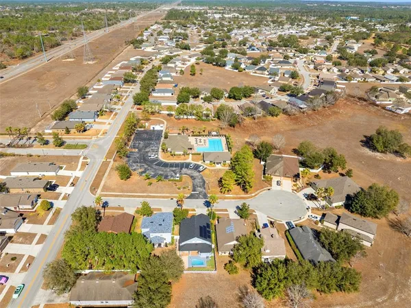 aerial view of a house with a yard