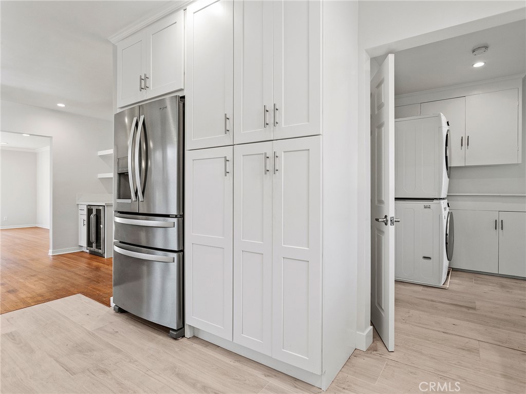 2739 Millicent Way Pasadena, CA 91107 - Photo 12 of 49 a kitchen with stainless steel appliances granite countertop a refrigerator and white cabinets