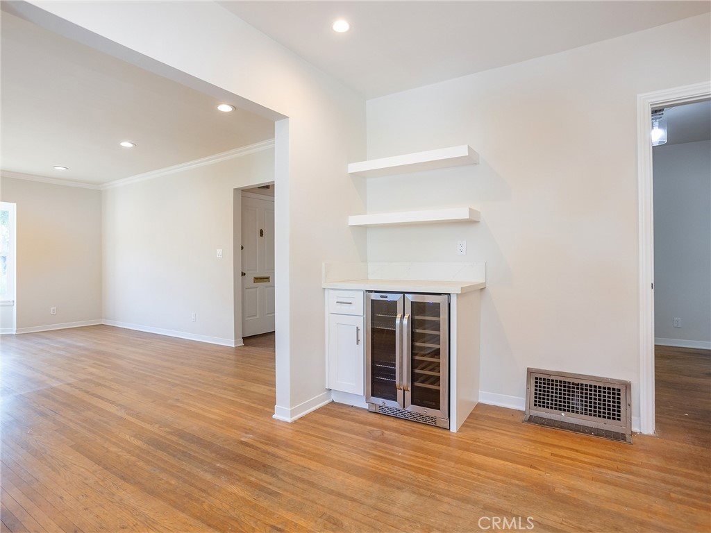 2739 Millicent Way Pasadena, CA 91107 - Photo 16 of 49 a view of an empty room with wooden floor fireplace and windows