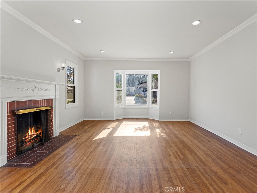 2739 Millicent Way Pasadena, CA 91107 - Photo 17 of 49 a view of an empty room with wooden floor fireplace and a window