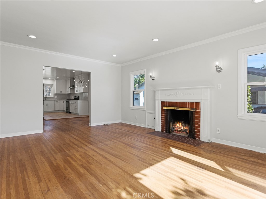 2739 Millicent Way Pasadena, CA 91107 - Photo 19 of 49 a view of empty room with wooden floor and fireplace