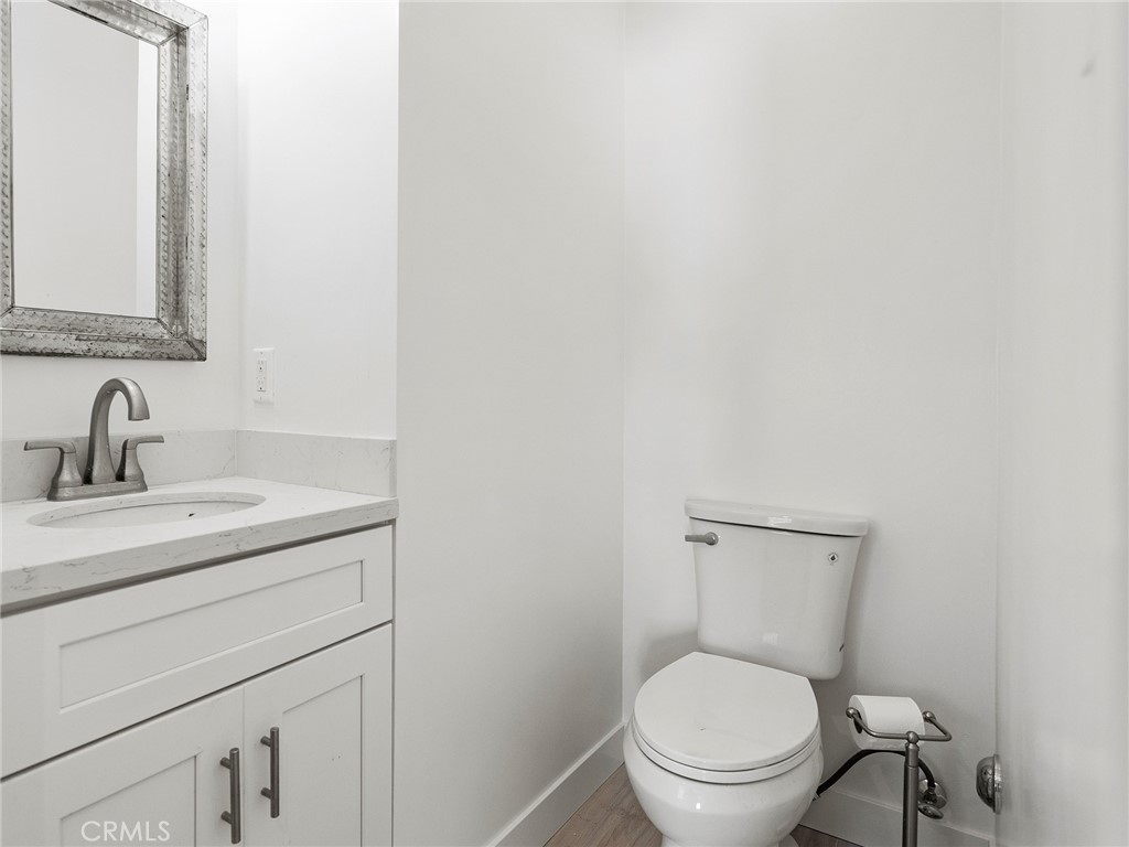 2739 Millicent Way Pasadena, CA 91107 - Photo 26 of 49 a bathroom with a toilet sink vanity and mirror