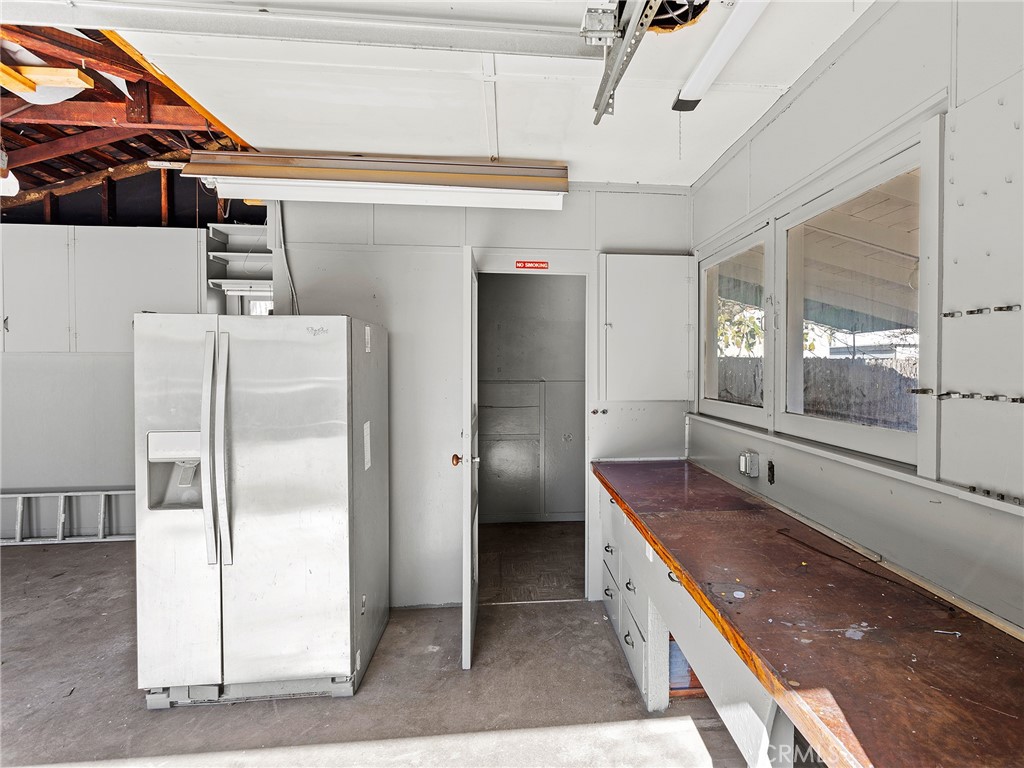 2739 Millicent Way Pasadena, CA 91107 - Photo 29 of 49 a bathroom with a granite countertop sink a mirror and shower