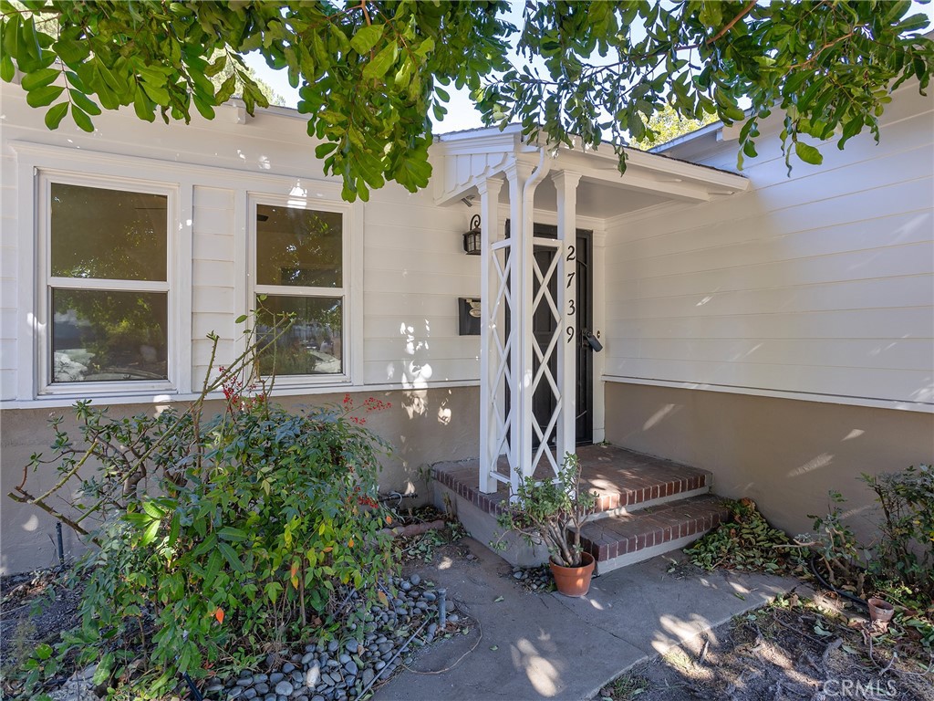 2739 Millicent Way Pasadena, CA 91107 - Photo 3 of 49 a front view of a house with a garden