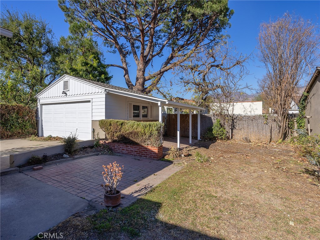 2739 Millicent Way Pasadena, CA 91107 - Photo 34 of 49 a view of a house with a yard covered with snow in the background