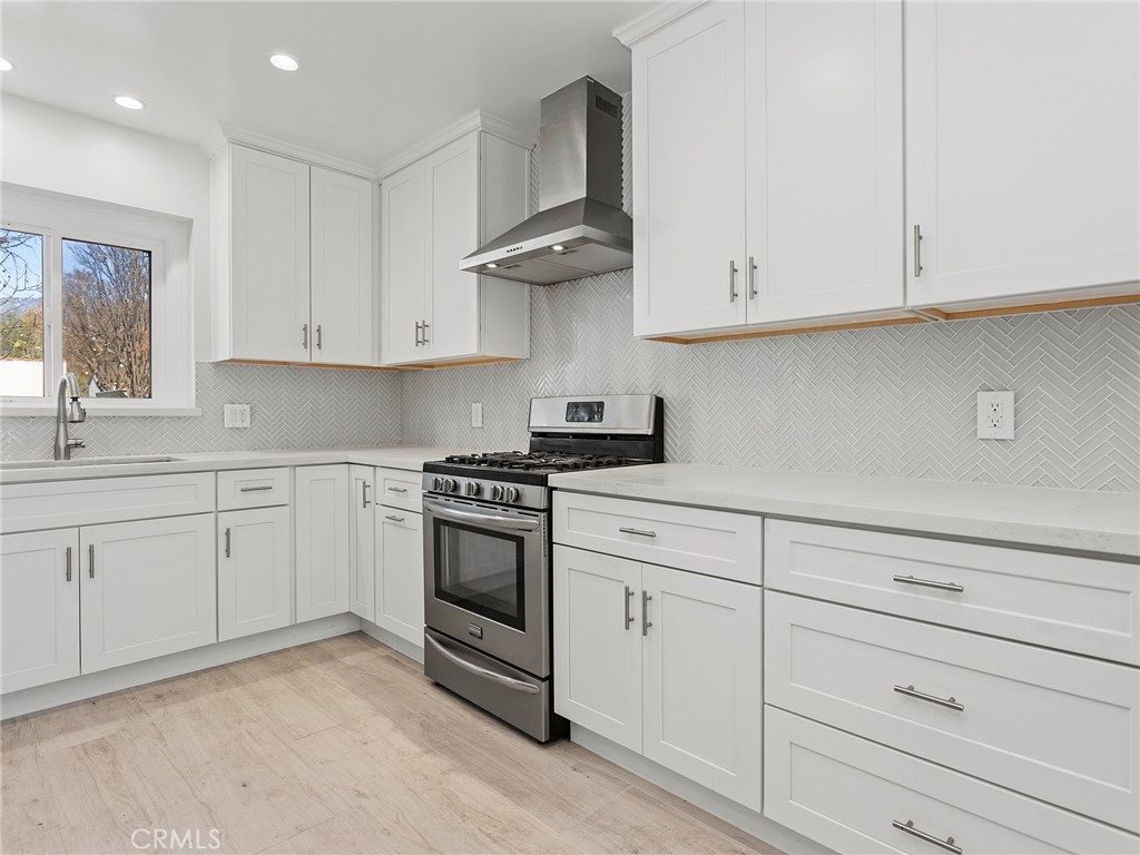 2739 Millicent Way Pasadena, CA 91107 - Photo 9 of 49 a kitchen with white cabinets and white appliances