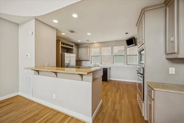 a view of kitchen with cabinets