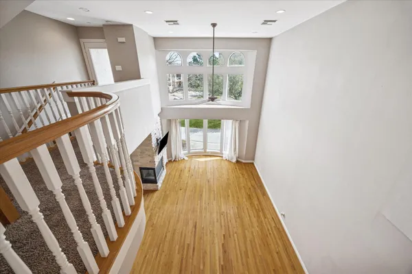 a view of an entryway with wooden floor