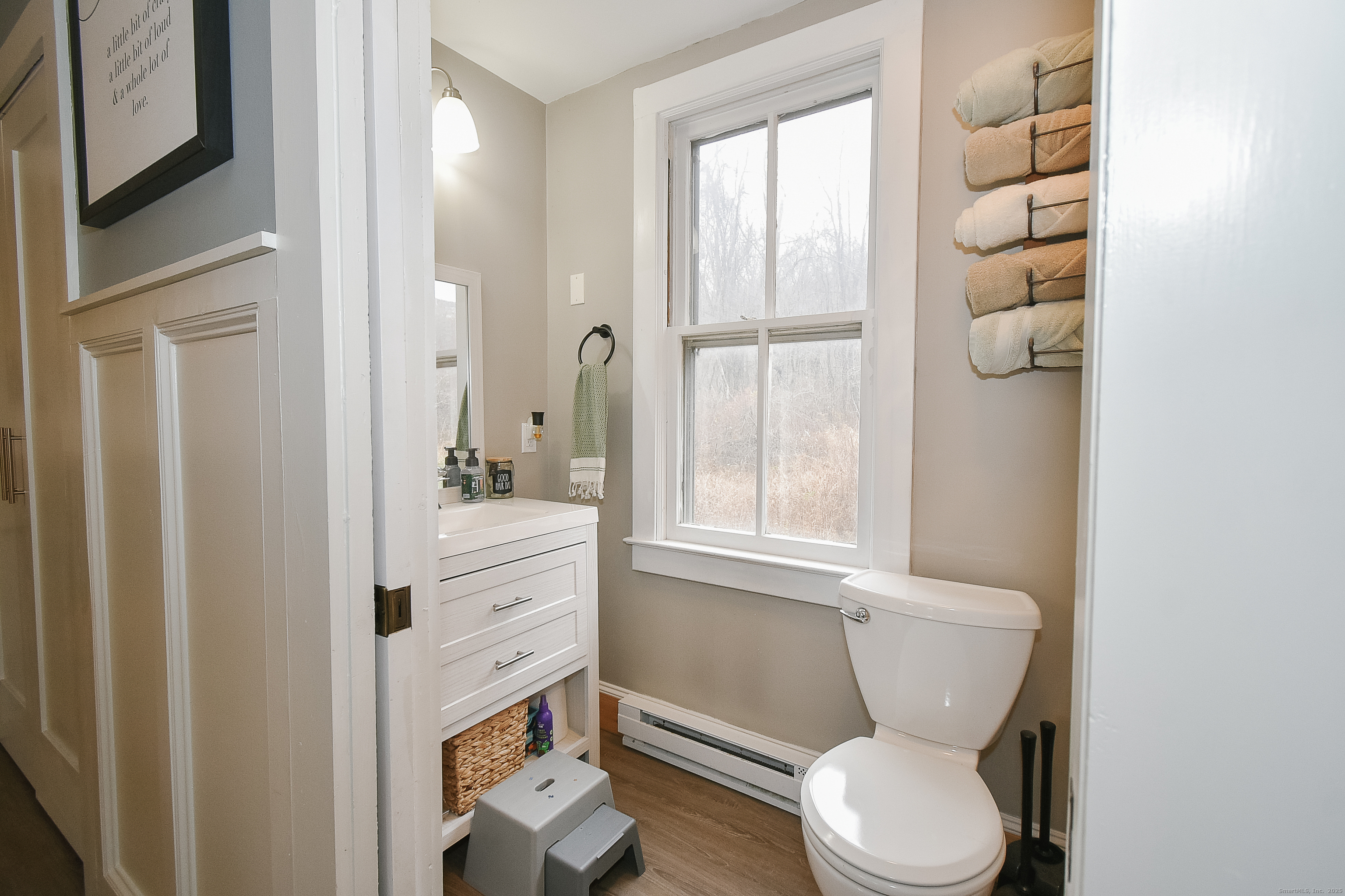 291 Hog Hill Road East Hampton, CT 06424 - Photo 15 of 24 a bathroom with a granite countertop toilet sink and mirror