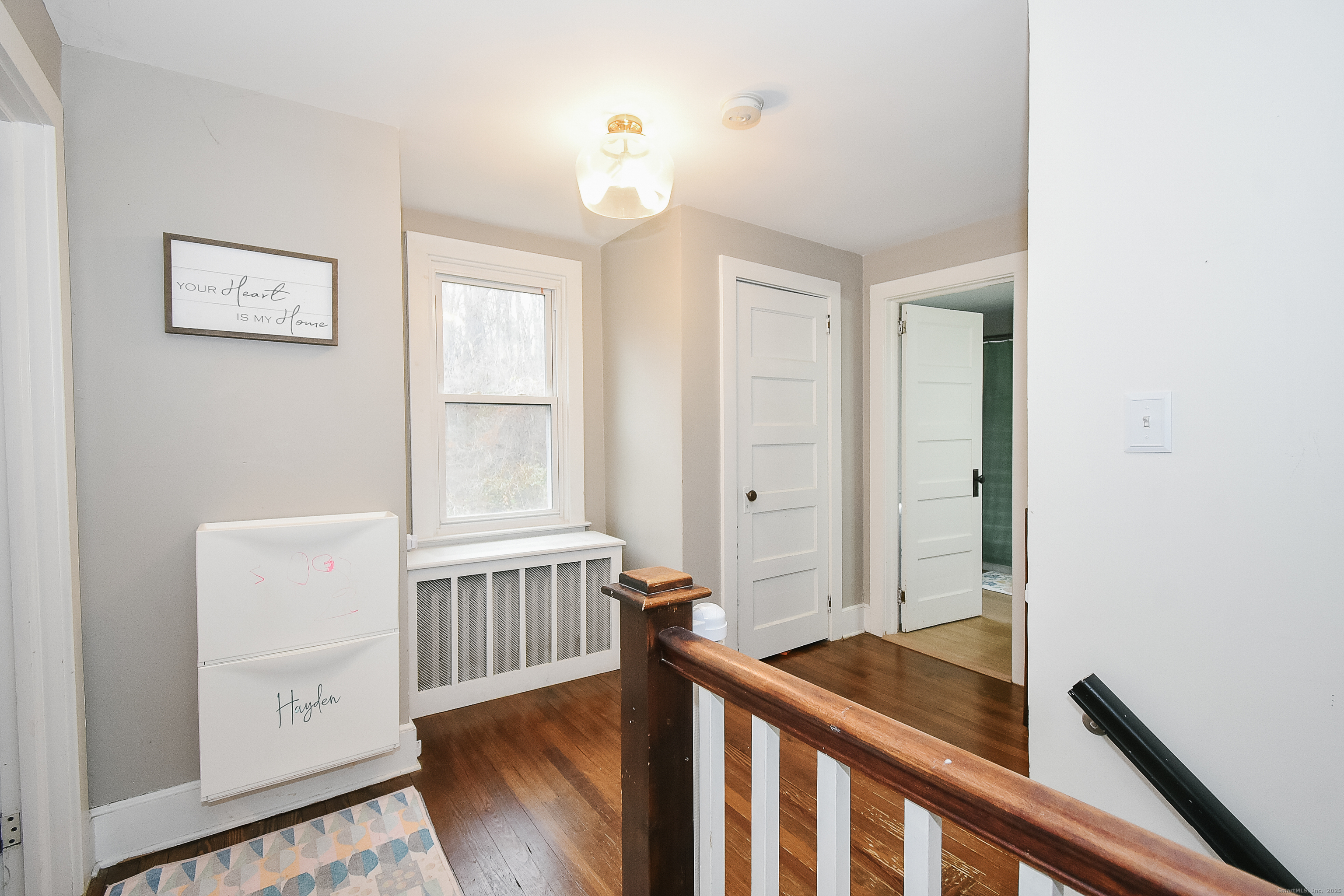 291 Hog Hill Road East Hampton, CT 06424 - Photo 16 of 24 a view of a hallway with windows and stairs