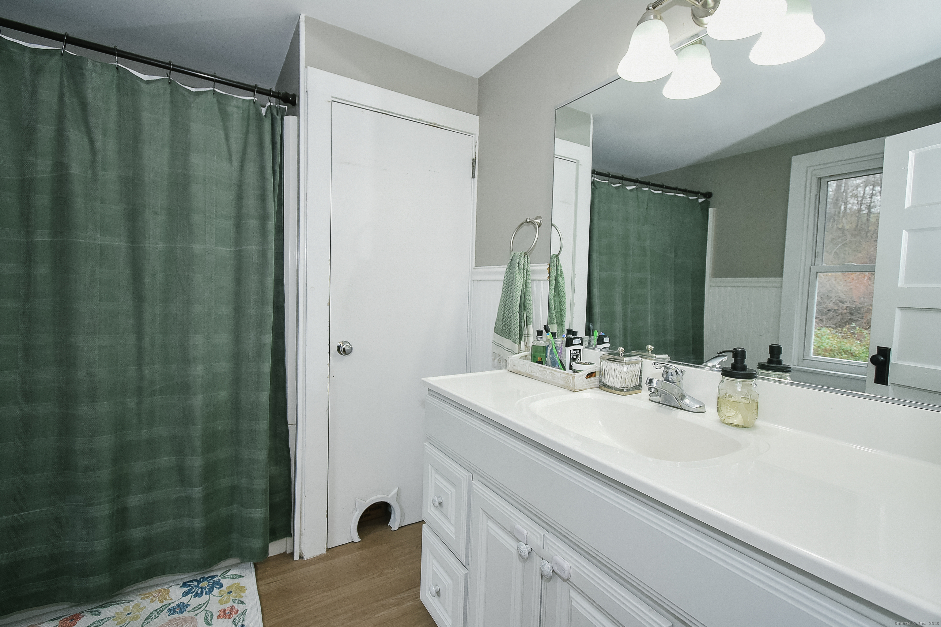 291 Hog Hill Road East Hampton, CT 06424 - Photo 24 of 24 a bathroom with a sink and a mirror