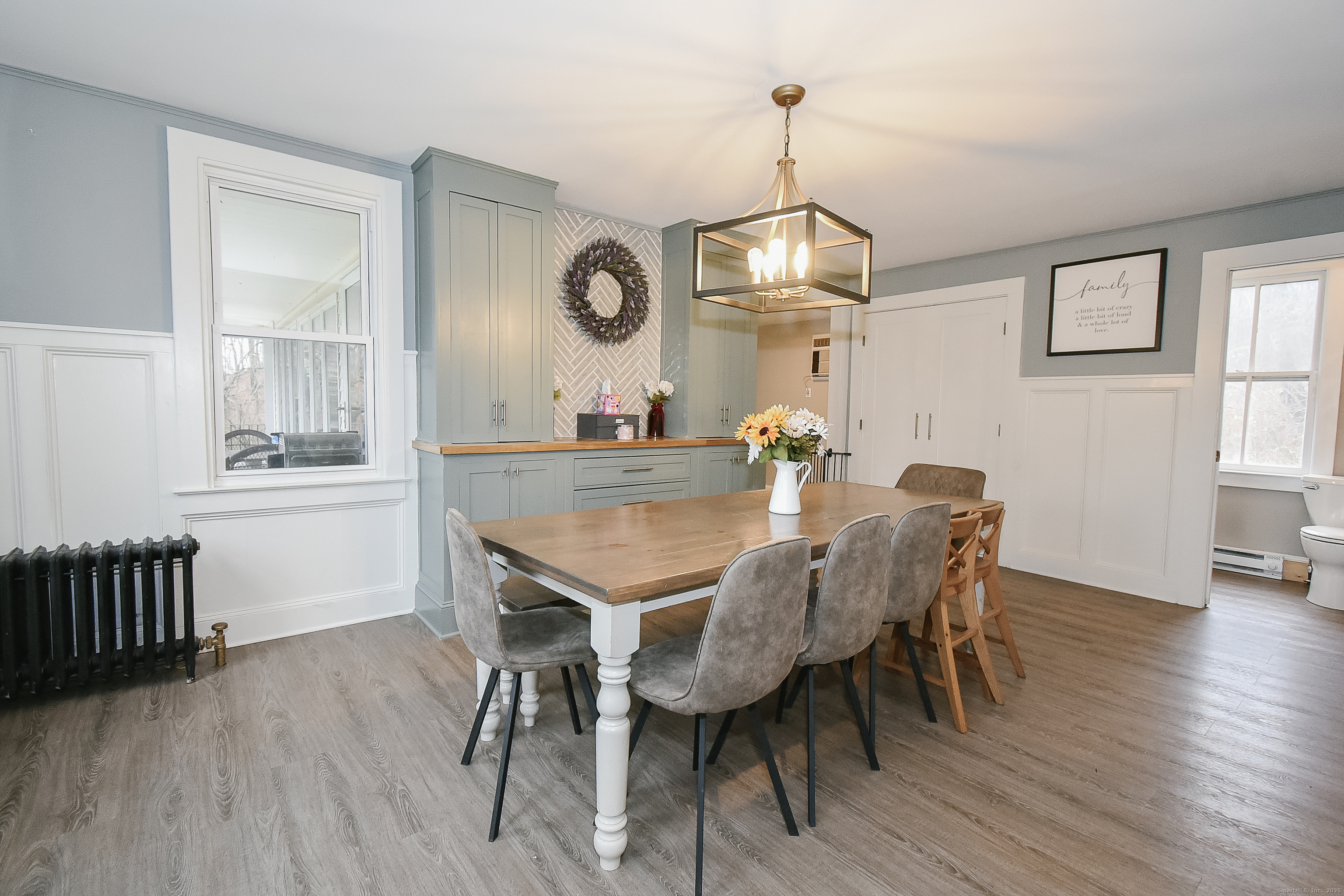 291 Hog Hill Road East Hampton, CT 06424 - Photo 3 of 24 a view of a dining room with furniture wooden floor and chandelier