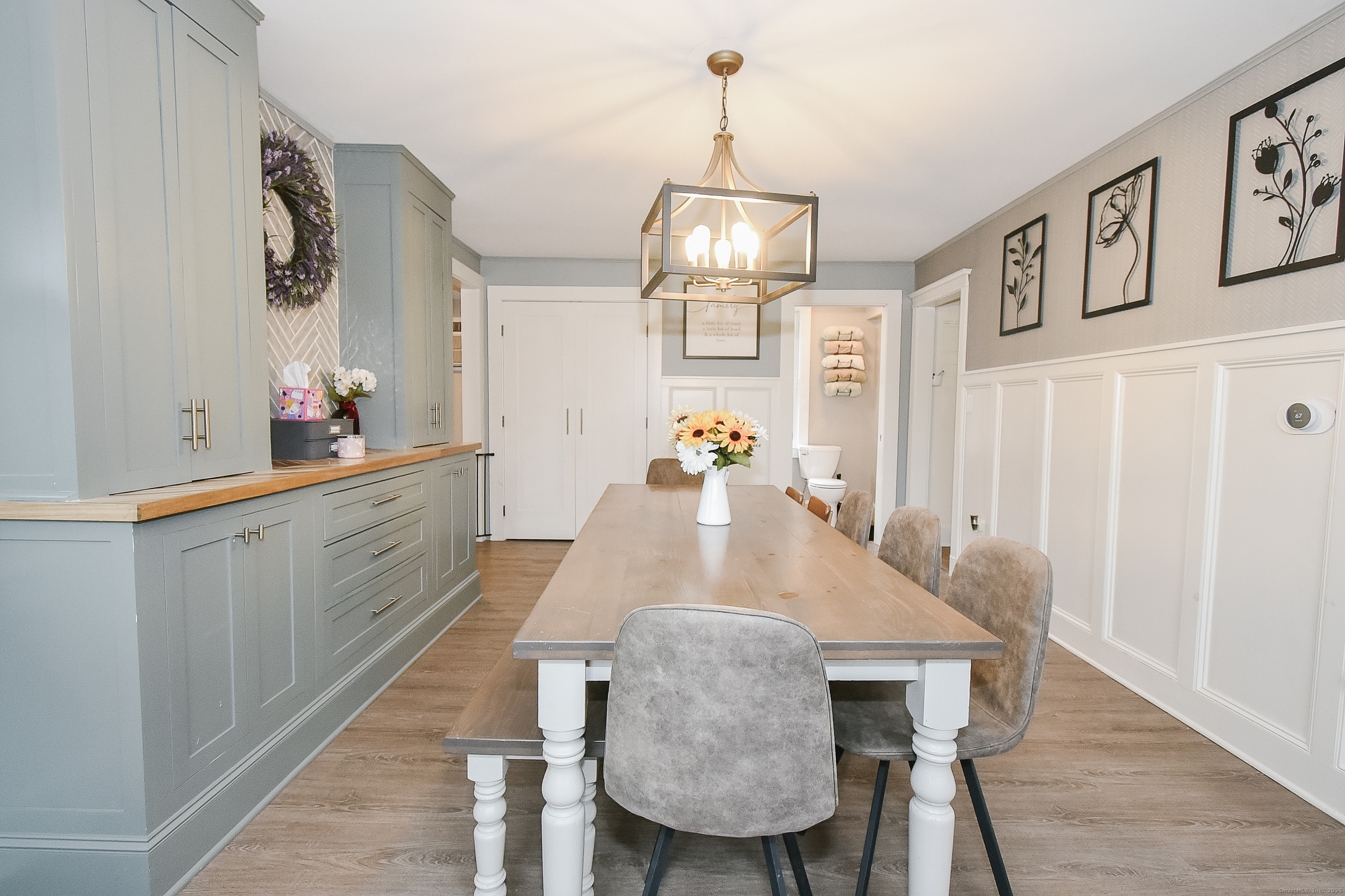 291 Hog Hill Road East Hampton, CT 06424 - Photo 5 of 24 a view of a dining room with furniture a chandelier and wooden floor