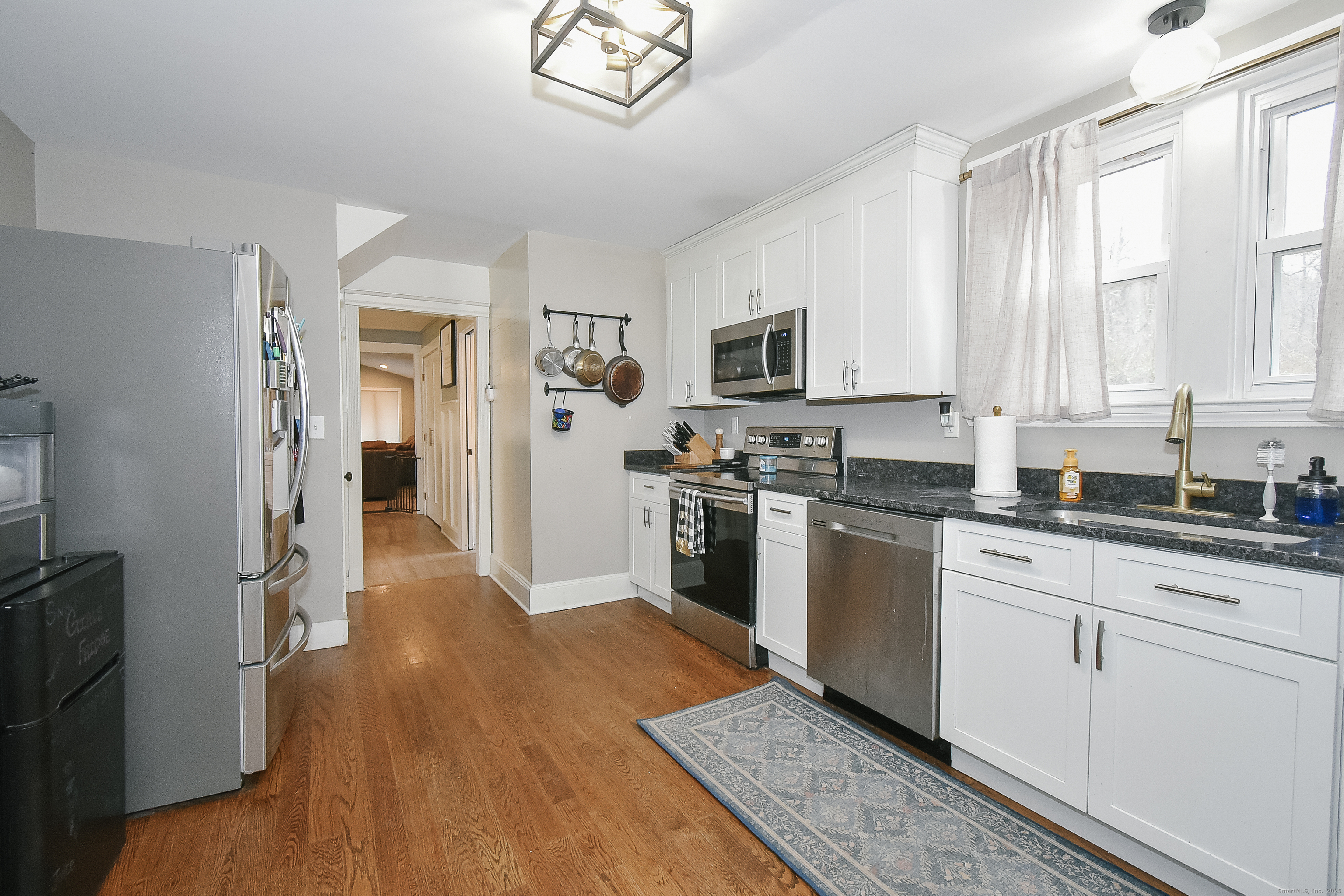 291 Hog Hill Road East Hampton, CT 06424 - Photo 8 of 24 a kitchen with granite countertop a refrigerator stove top oven and sink