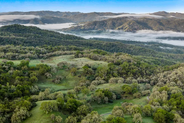 a view of a field of mountains and valleys