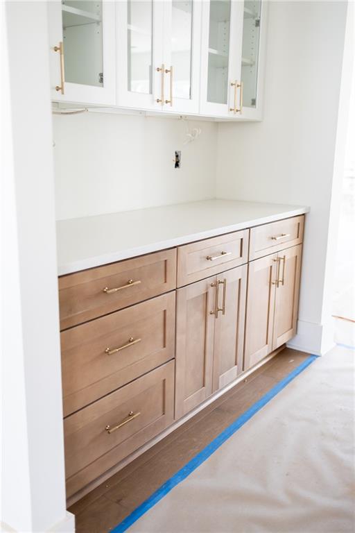 3150 Trickum Road Marietta, GA 30066 - Photo 3 of 19 a view of white cabinets with wooden floor