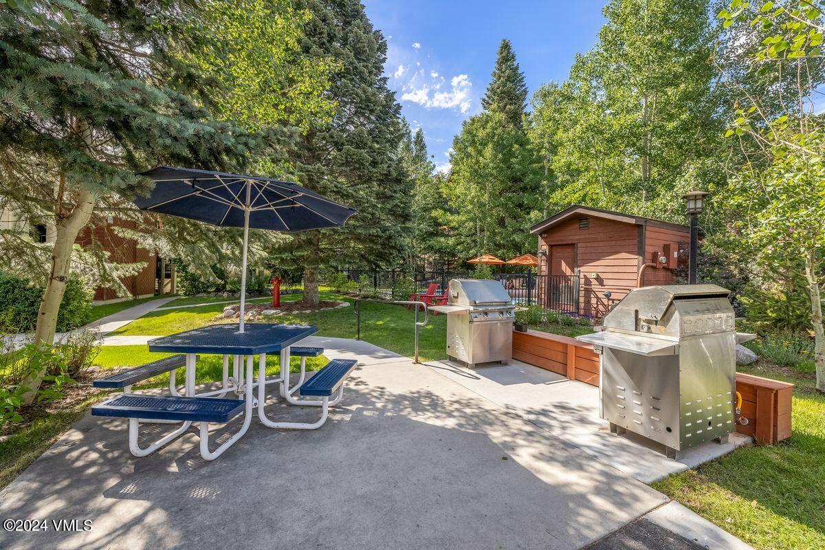 442 South Frontage Road East, Unit A205 Vail, CO 81657 - Photo 19 of 24 an outdoor space with swimming pool and furniture
