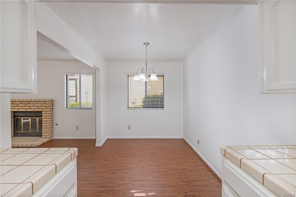 49400 River Park Road, Unit 17 Oakhurst, CA 93644 - Photo 3 of 34 a view of an empty room with window and fire place