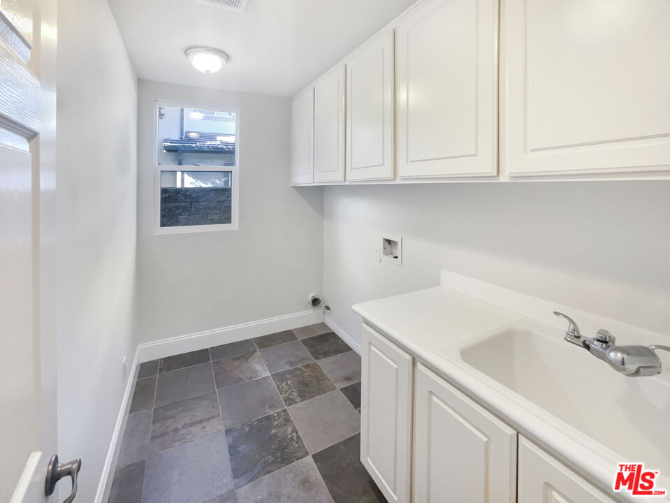 3946 Whistle Train Road Brea, CA 92823 - Photo 15 of 34 a utility room with cabinets