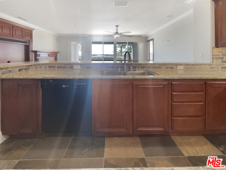 3946 Whistle Train Road Brea, CA 92823 - Photo 17 of 34 a kitchen with stainless steel appliances granite countertop a sink and cabinets