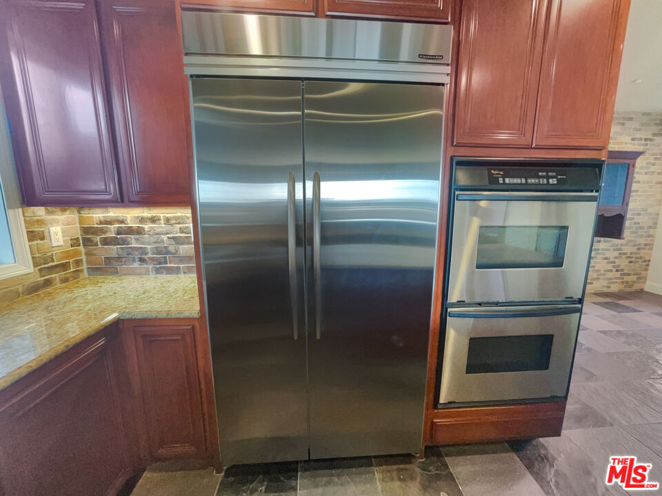 3946 Whistle Train Road Brea, CA 92823 - Photo 18 of 34 a kitchen with a refrigerator and a sink