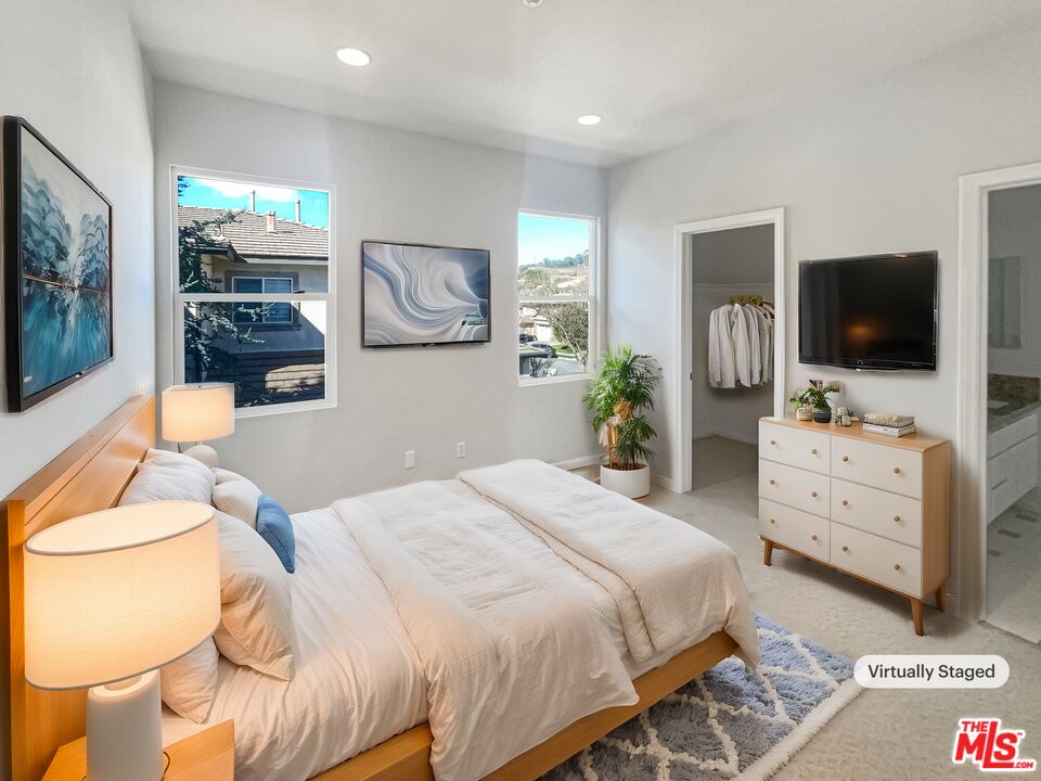 3946 Whistle Train Road Brea, CA 92823 - Photo 4 of 34 a bedroom with a bed and flat screen tv