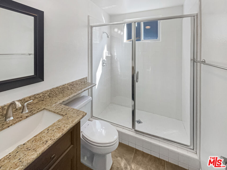 3946 Whistle Train Road Brea, CA 92823 - Photo 7 of 34 a bathroom with a granite countertop sink toilet and shower